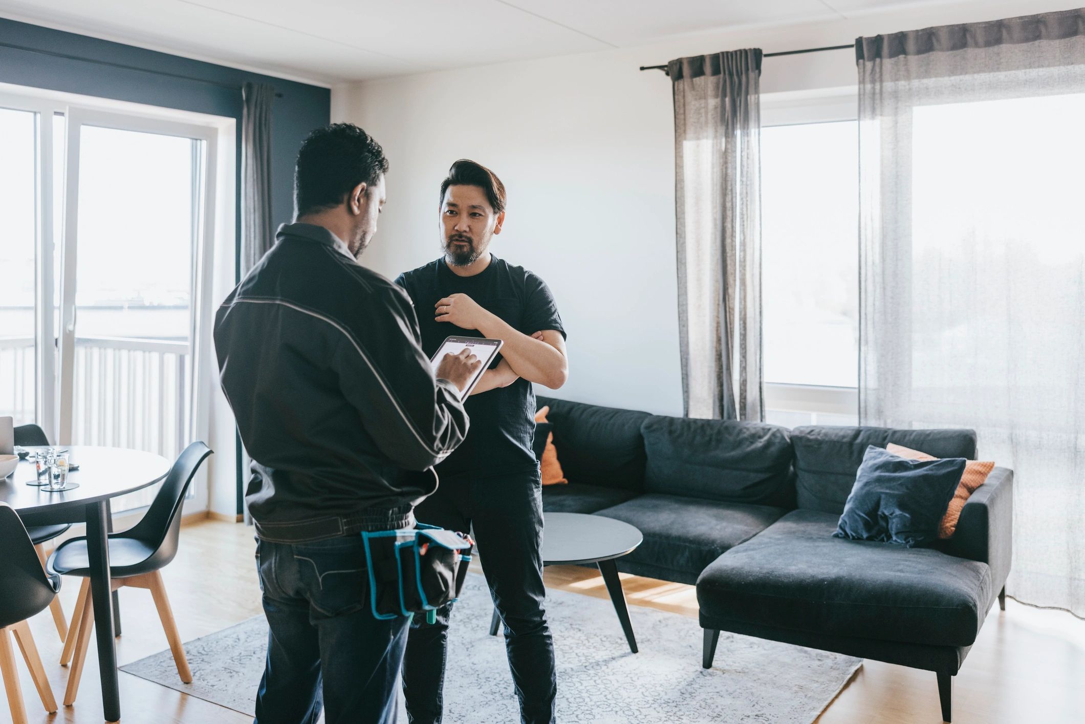 Service technician speaking with a customer about a home project