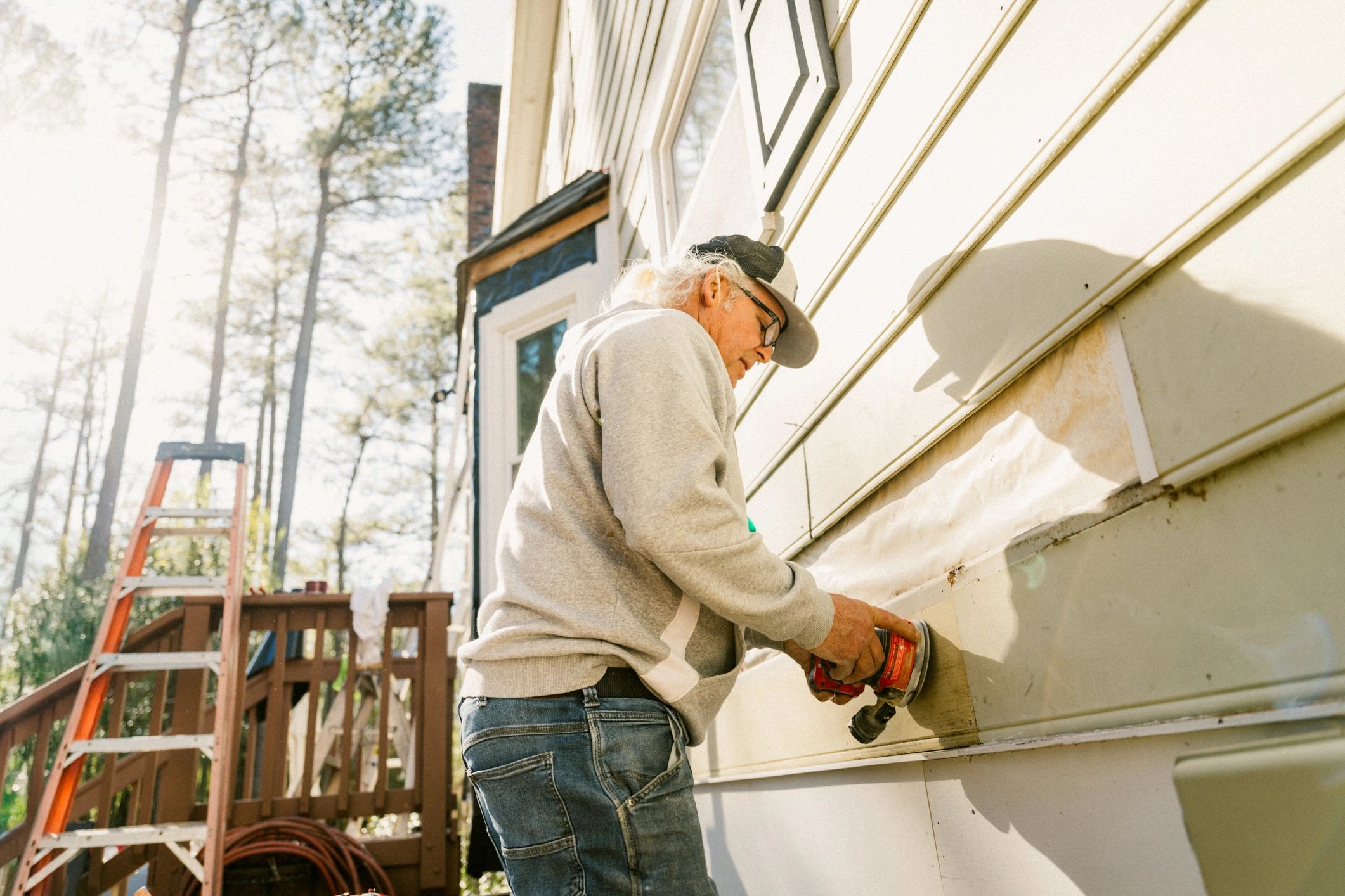 Technician working on a home's gutter system